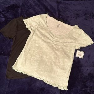 2 pack girls shirts - one is green with white designs & the other is plain black